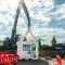 RECO 1 MWh batterijcontainer wordt met een kraan op locatie geplaatst voor tijdelijke energieopslag.