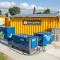 Zonnepanelen op tijdelijke bouwcontainers met RECO stroomvoorziening op een bouwplaats.