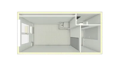 Plattegrond van een kantoorunit met toilet, keuken en open kantoorruimte