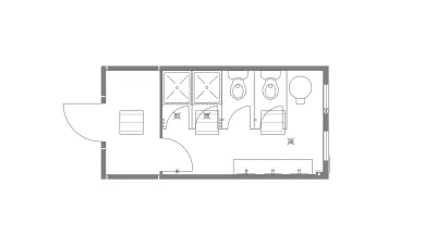 Plattegrond van sanitairunit met 2 douches en 2 toiletten.