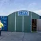 Werkplaatscontainer van RECO op een bouwplaats met tijdelijke werkruimte