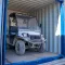 Elektrische Site Carrier geparkeerd in een container op de bouwplaats